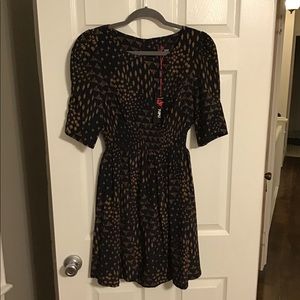 Navy and beige print dress with cinched waist